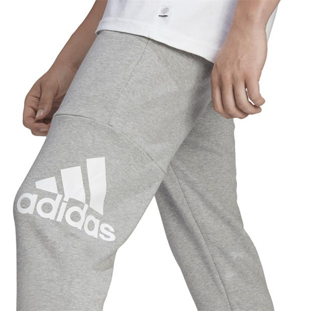 Pantaloni sport adidas Essentials French Terry conici Cuff Logo gri deschis